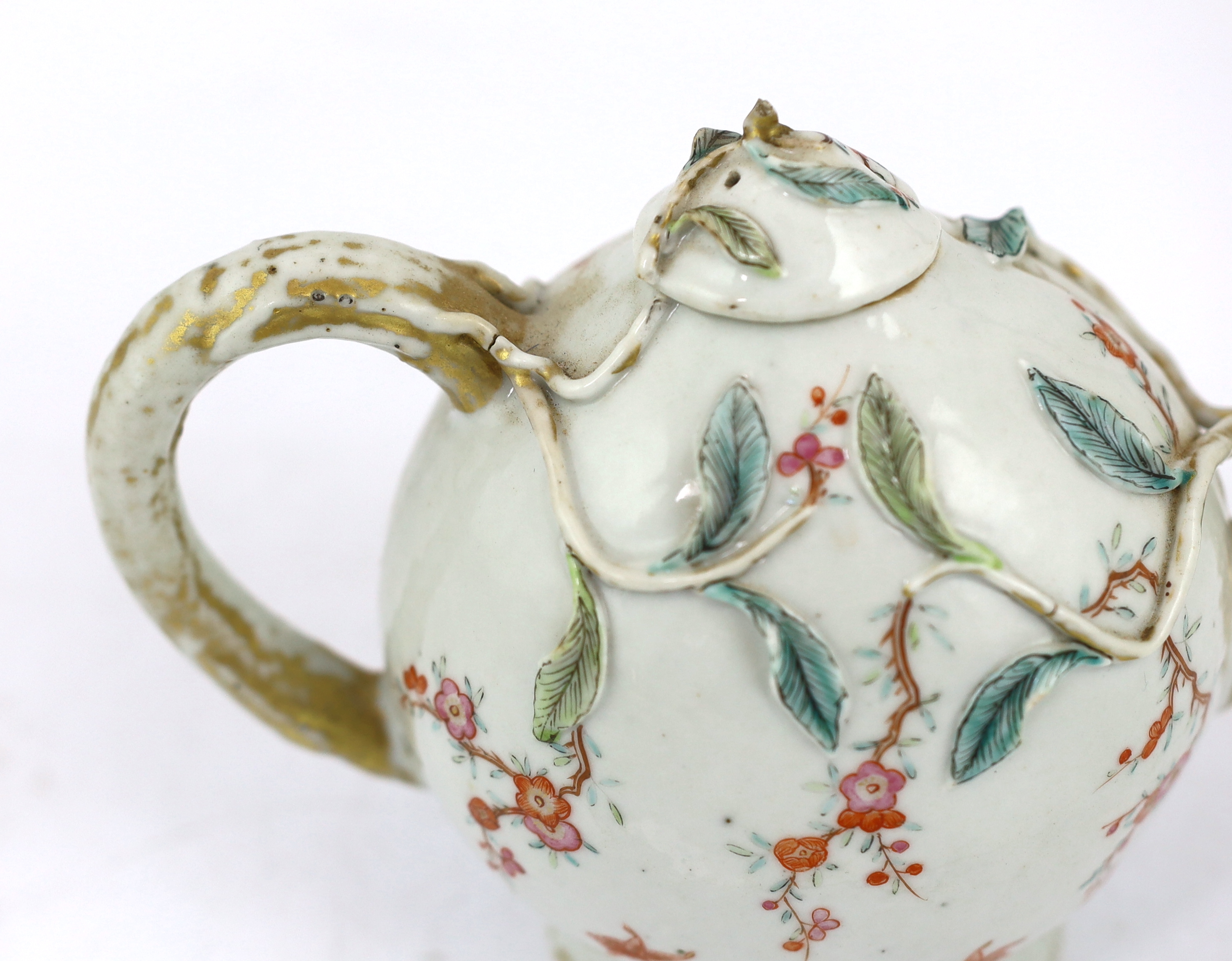 A Chinese enamelled porcelain peach-shaped teapot, Qianlong period (1736-95), wear to gilding
